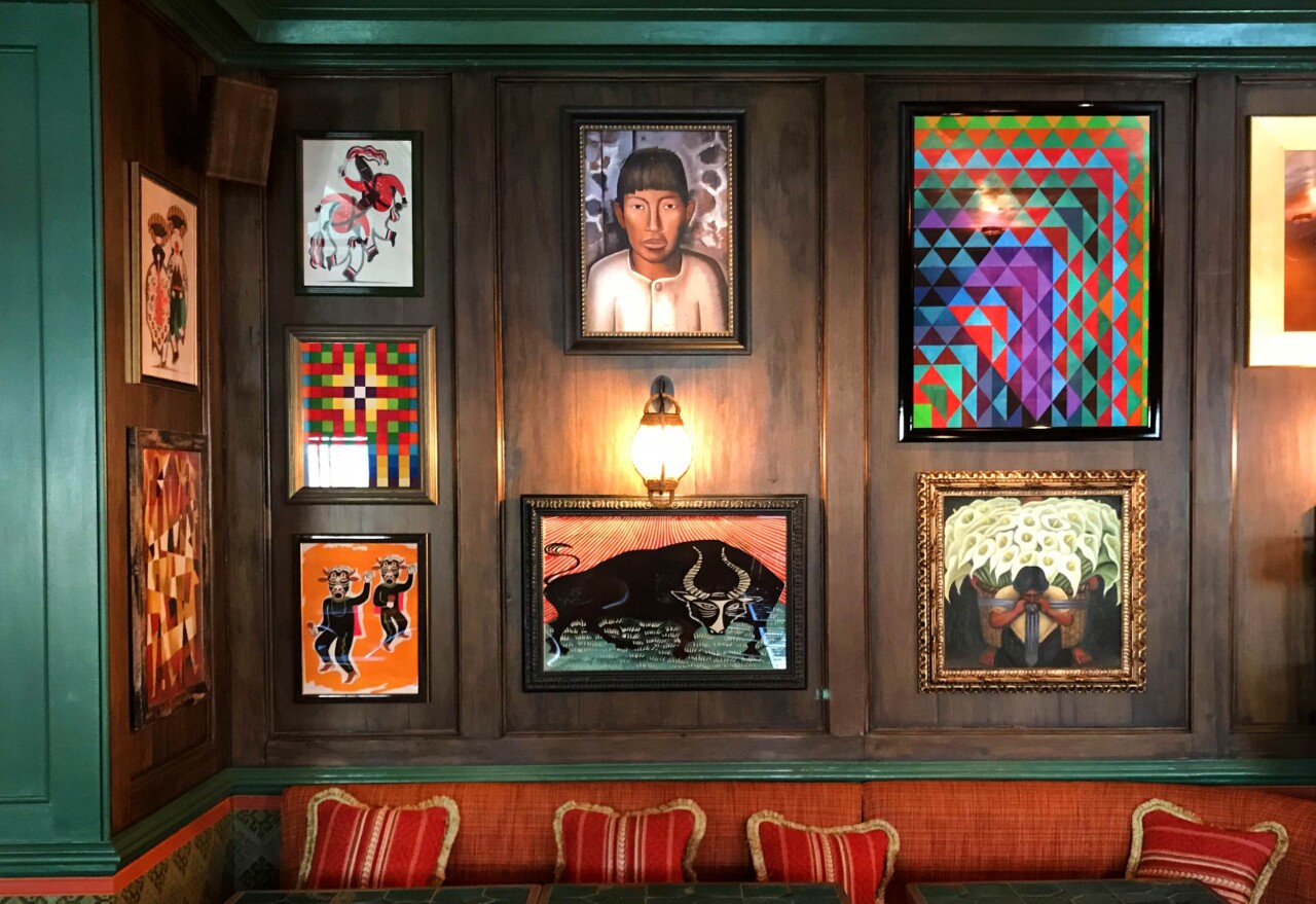 Mixed paintings and graphics hung together in the Mexican Room