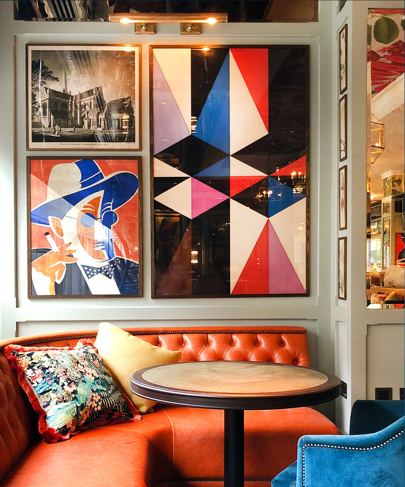 contemporary artwork and topographic prints in restaurant panelling