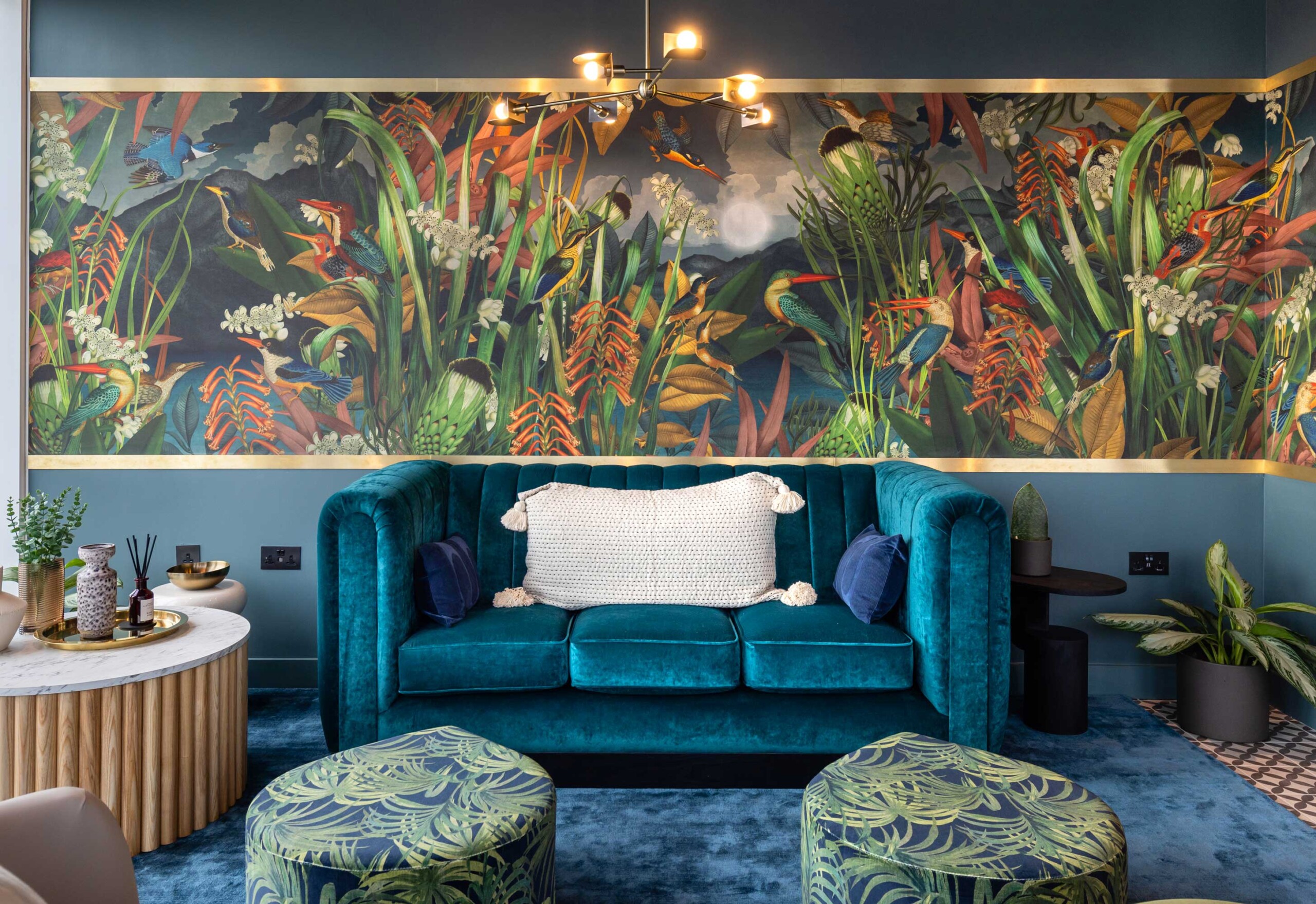 Halcyon wallpaper design filled with colourful kingfishers amongst river reeds and botanicals