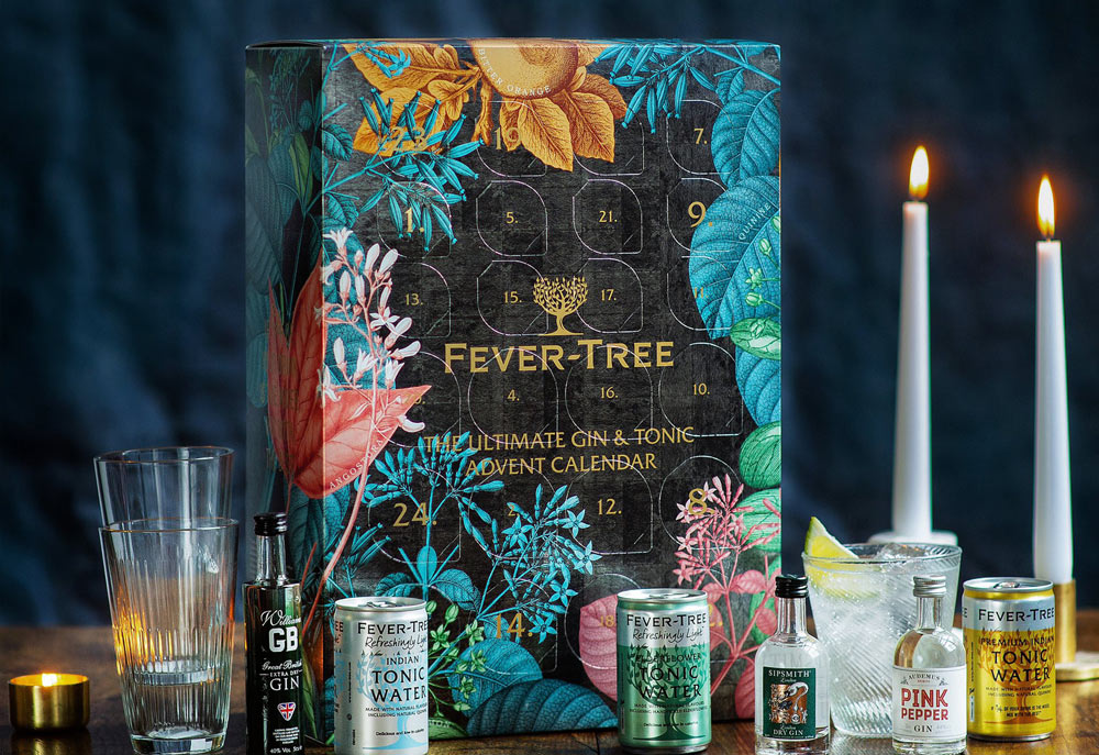 The Fever-Tree advent calendar surrounded by alchoholic beverages that could be drunk with a mixer.