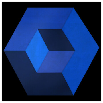 A three dimensional blue geometric shape against a dark textured background